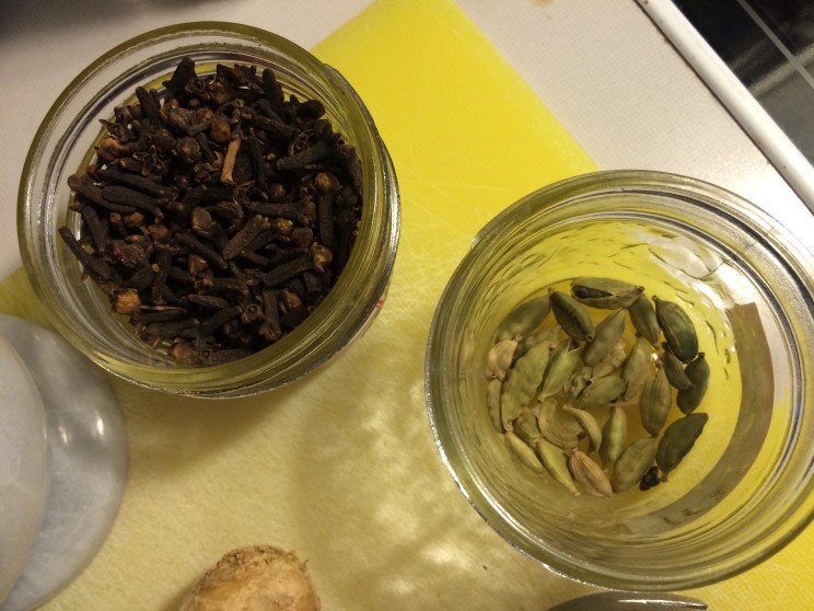 Cloves left, cardamom pods right